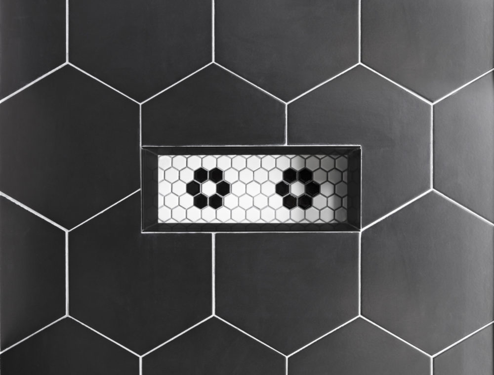 Matte black hexagon tiled shower