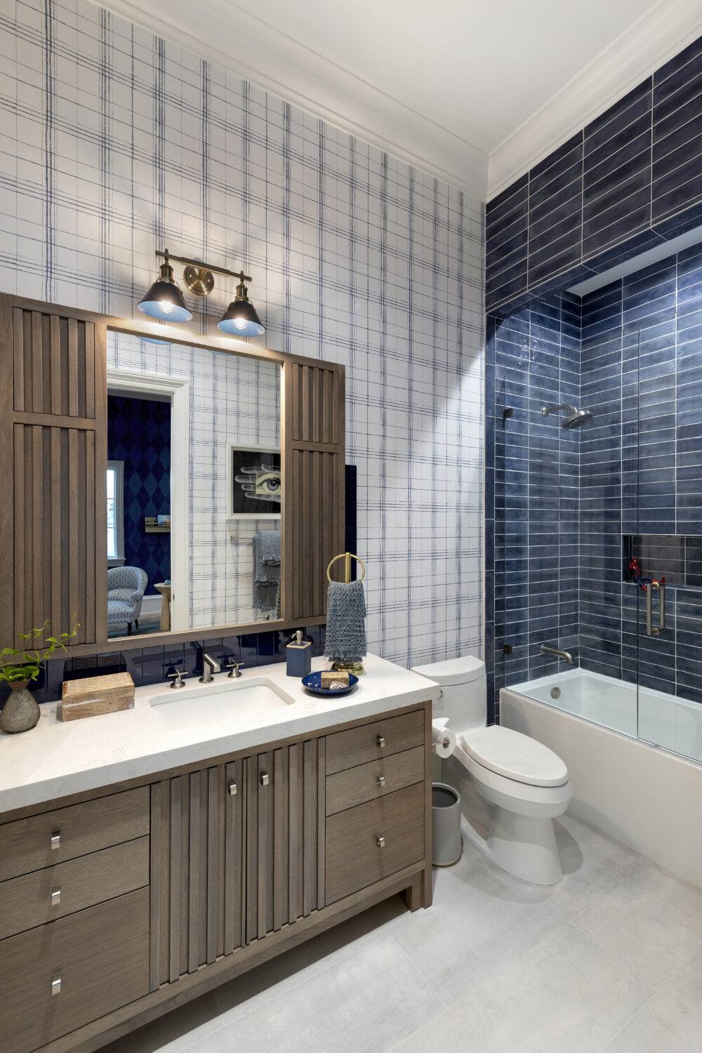 Boys' blue bathroom featuring Ionic White, Splendours Blue Night, Splendours Blue Night trim and Glass Nautical Blue tile.  