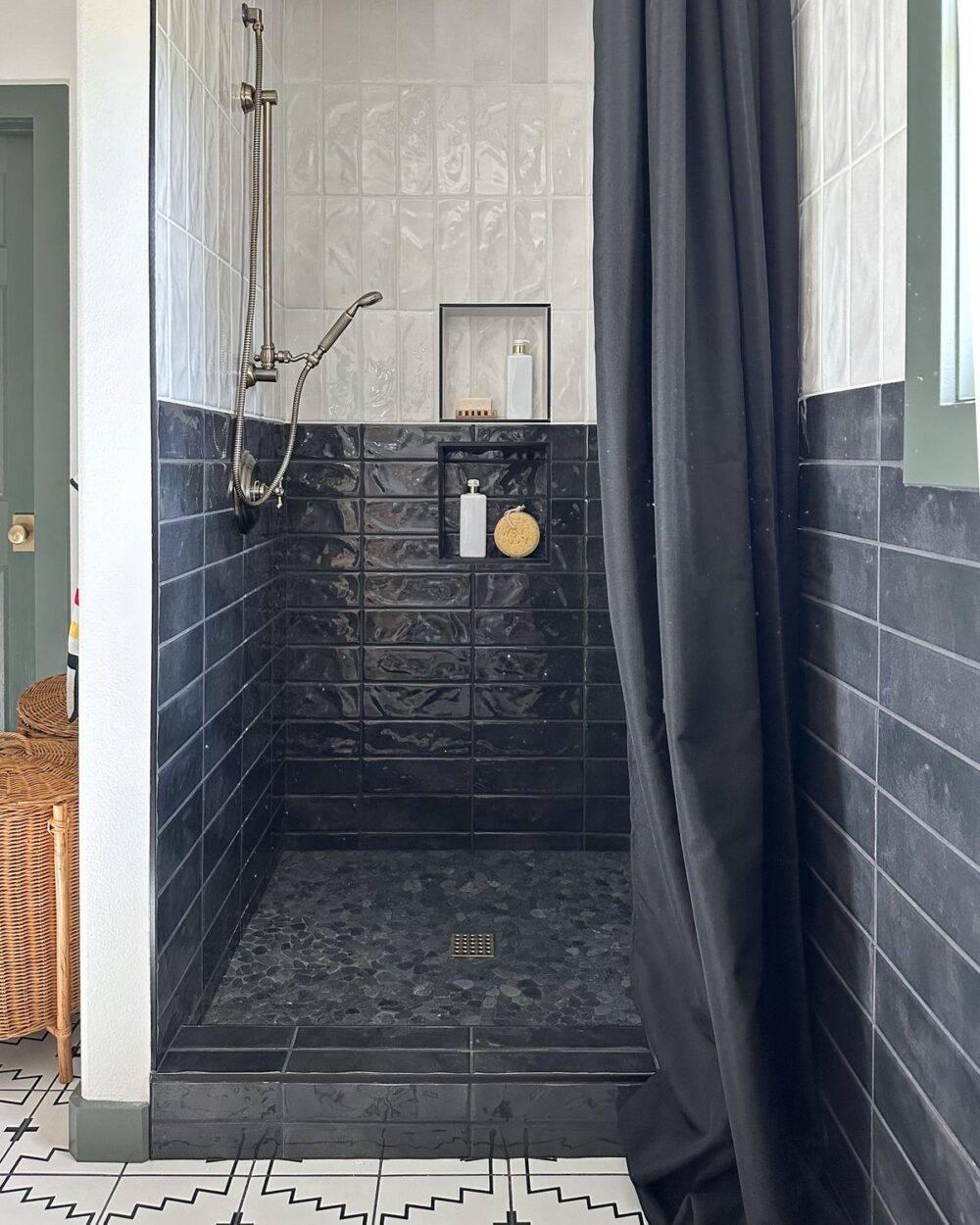 Shower with black and white subway tiles. 