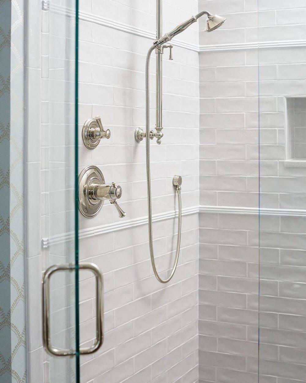 Shower with white subway tile wall. 