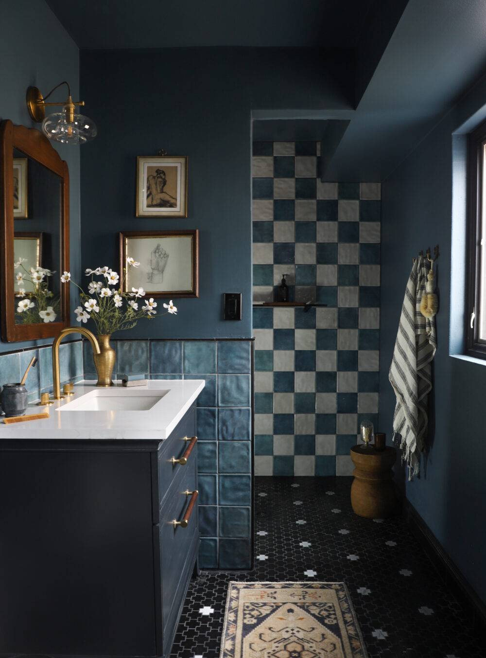 Bathroom with blue and white handmade-look square tile. 