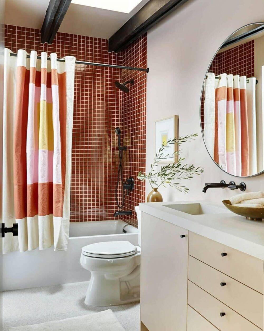 Bathroom with glossy red square mosaic tile shower. 