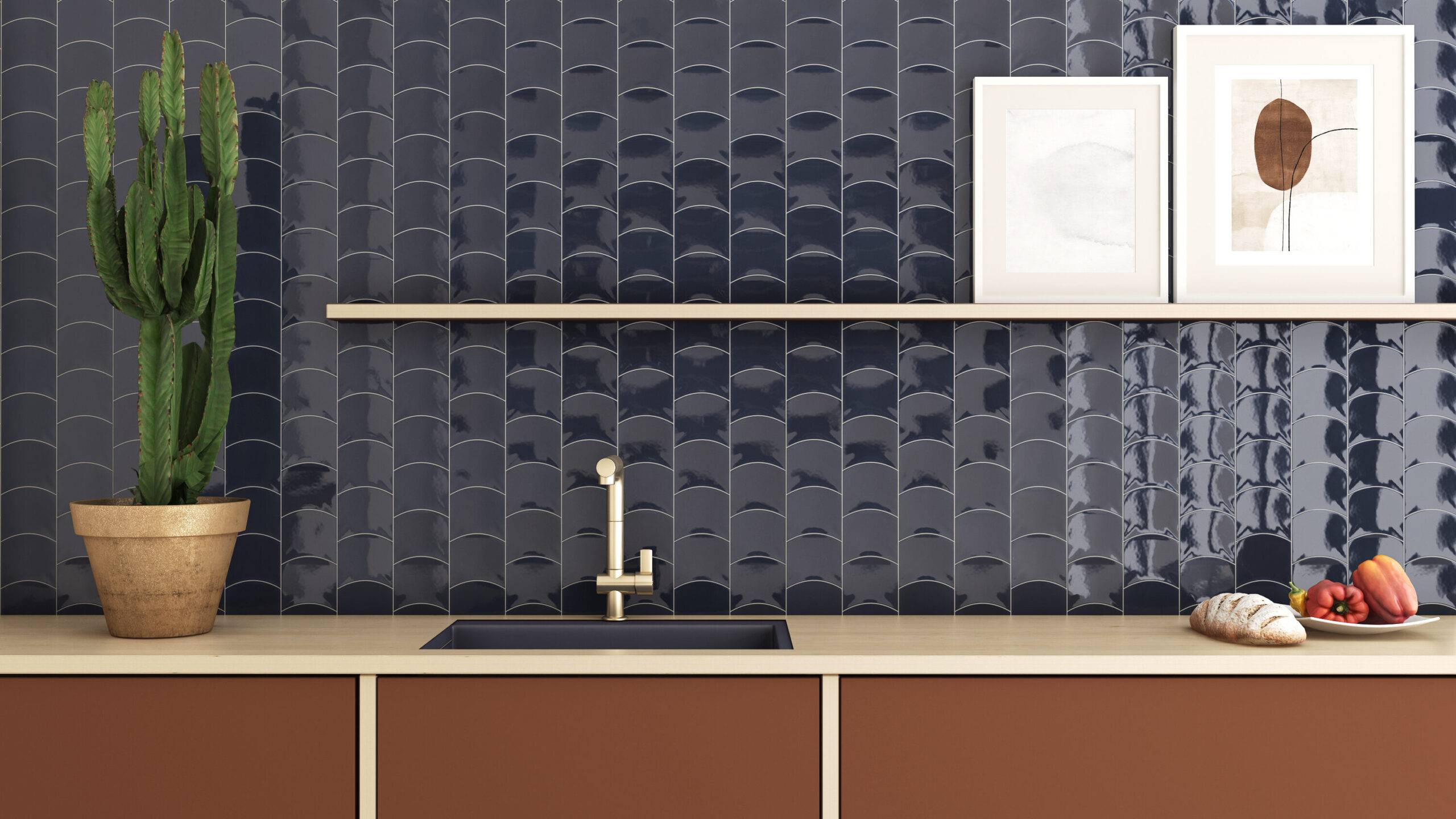 Wavy blue ceramic wall tiles behind a kitchen counter and brown cabinets.