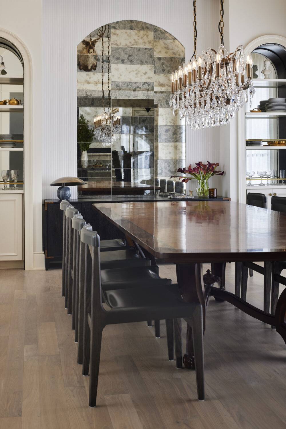 Dining room with white fluted tile and gilded mirrored tile. 