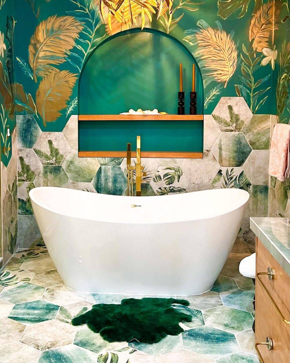 This bright teal bathroom features a lush botanical patterned hexagon tile. 
