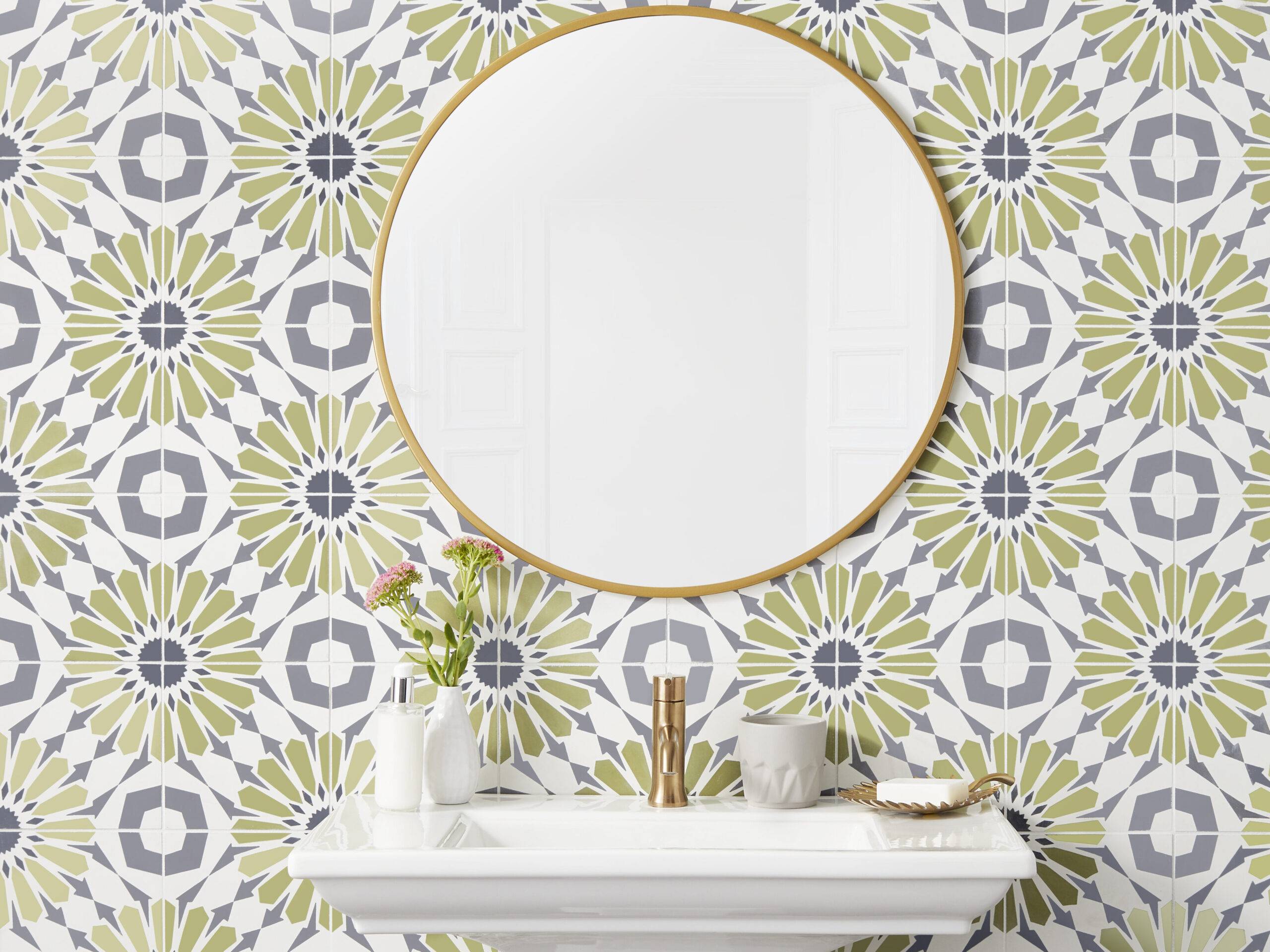 This 8" x 8" encaustic tile design uses a series of angular shapes to create a pattern that resembles a flower petal or starburst. Used behind this white vessel sink and mirror as a feature wall.  