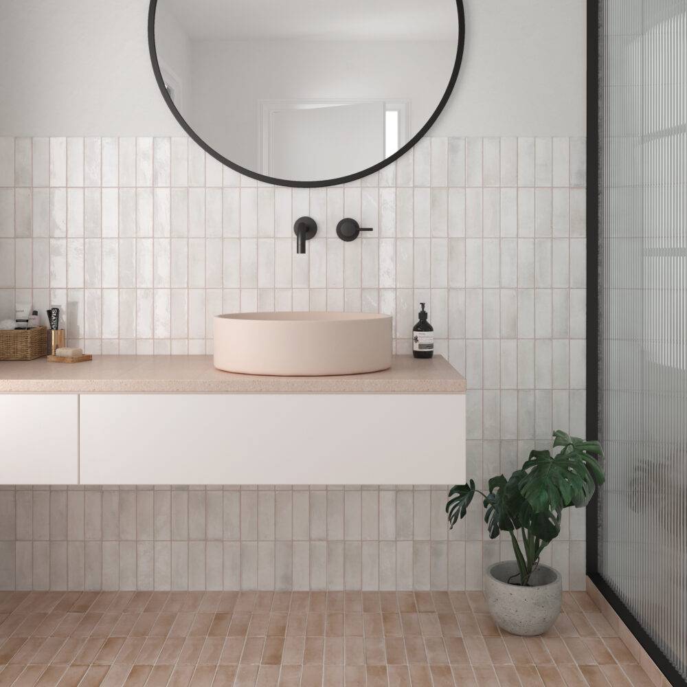 This bright, modern bathroom features white handmade-look subway tile backsplash. 