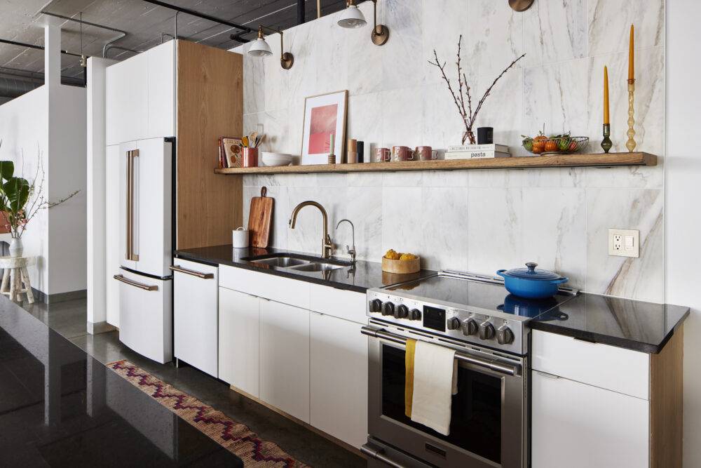 This bright, modern kitchen features a marble slab-look backsplash.