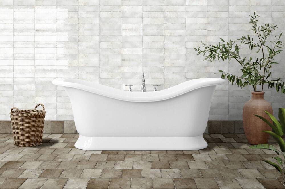 A large bathroom with brown tiles with an aged appearance. 