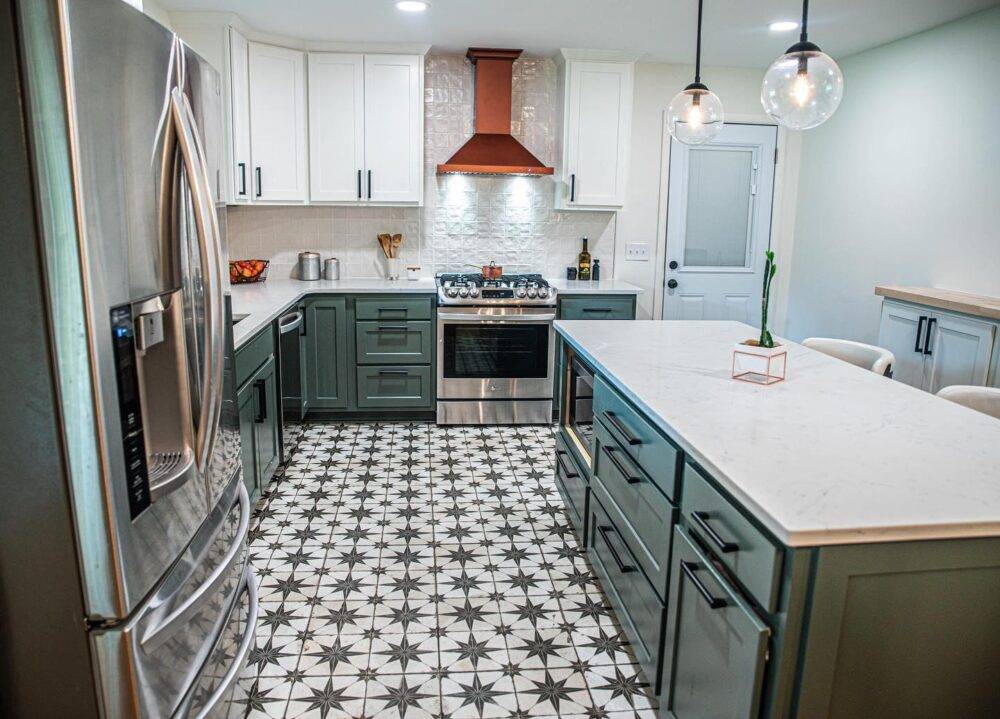 This chic modern kitchen features a star patterned handmade-look tile floor. 